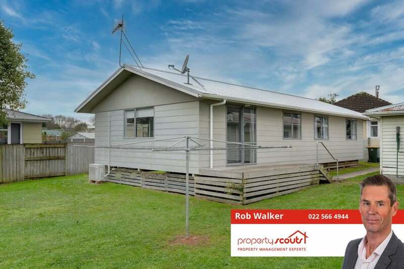 This is a very spacious 4-bedroom house with a great section behind for the kids!